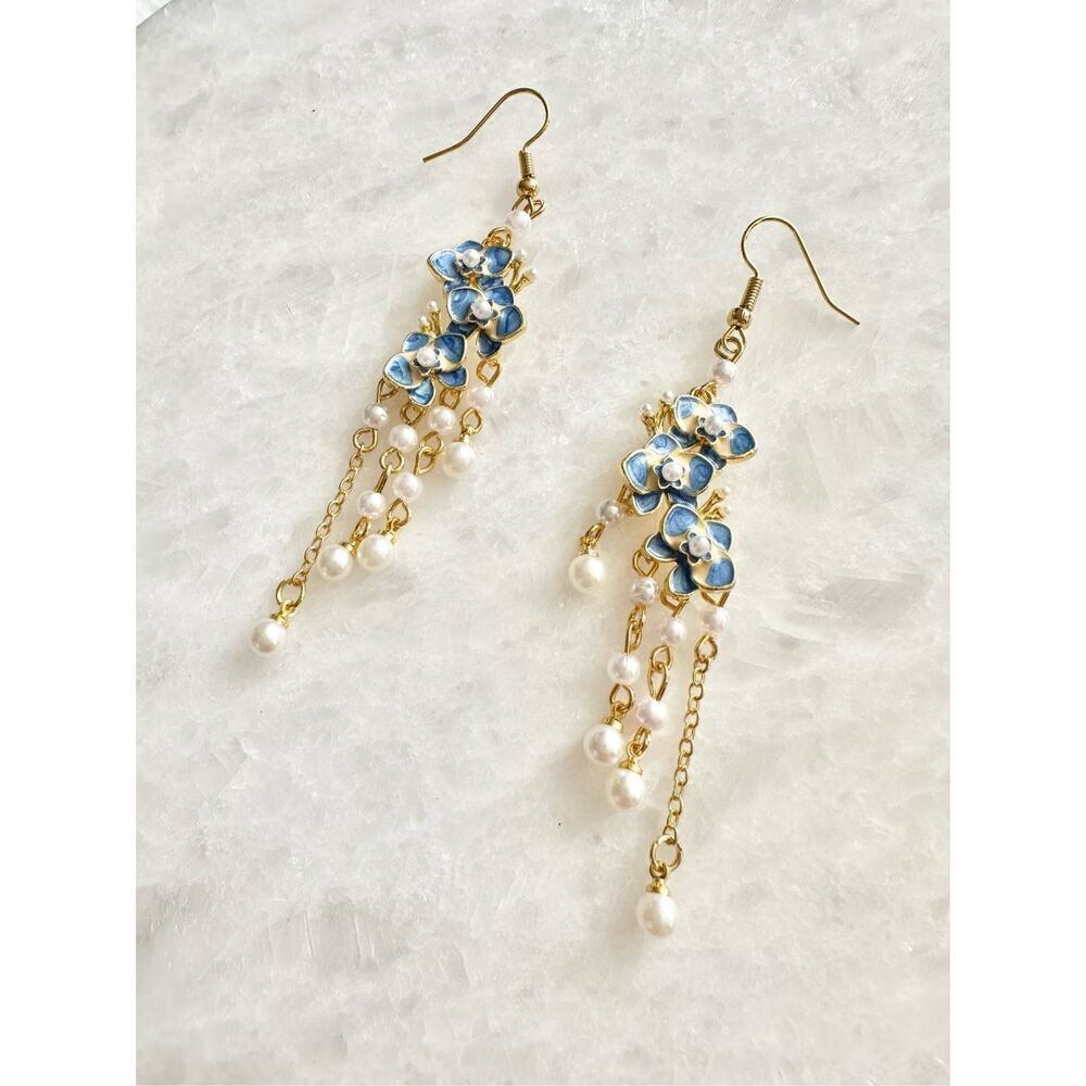 Light blue and gold faux pearl orchid chandelier earrings ￼